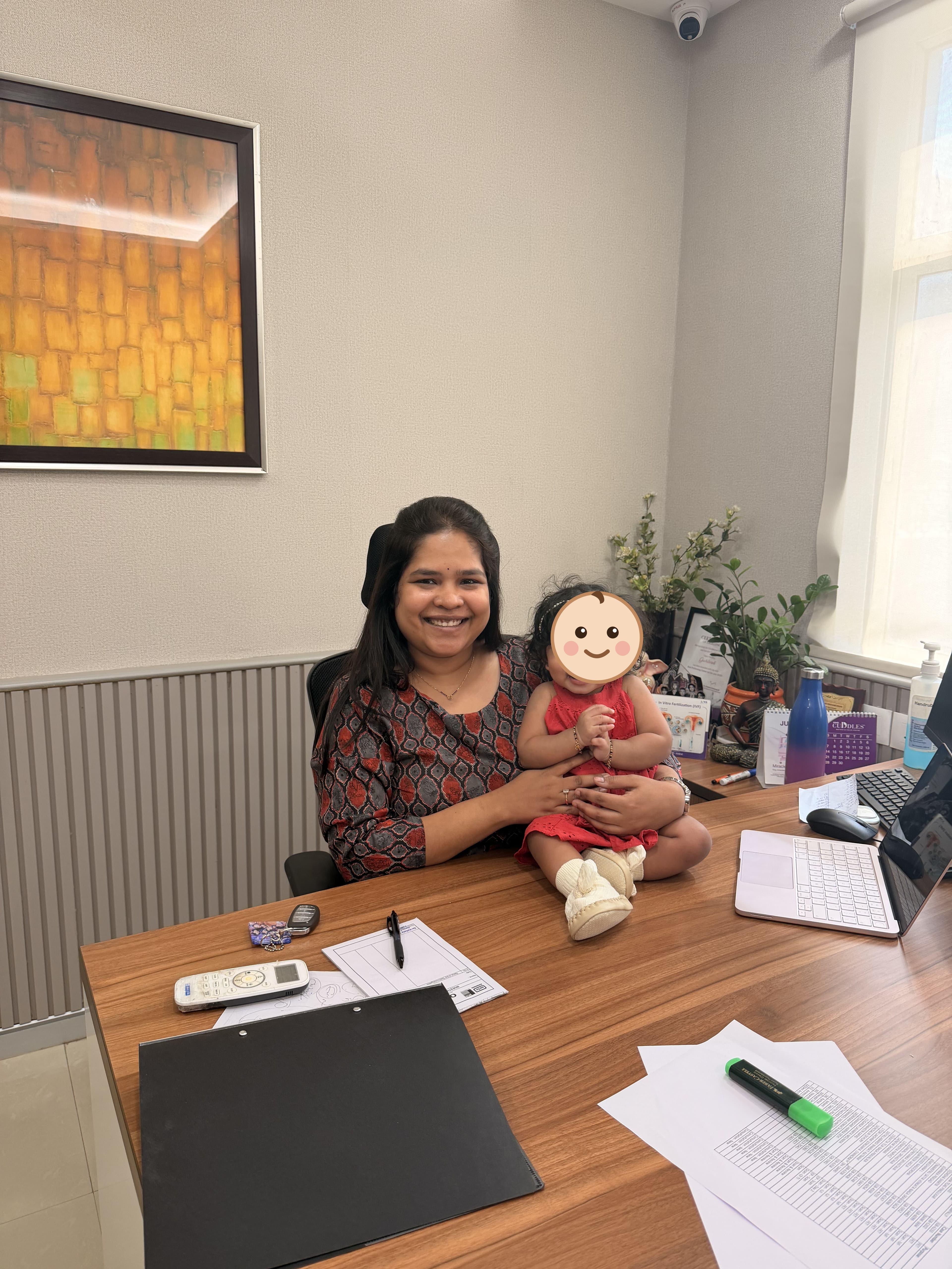 A mother and her baby daughter in the consulting room